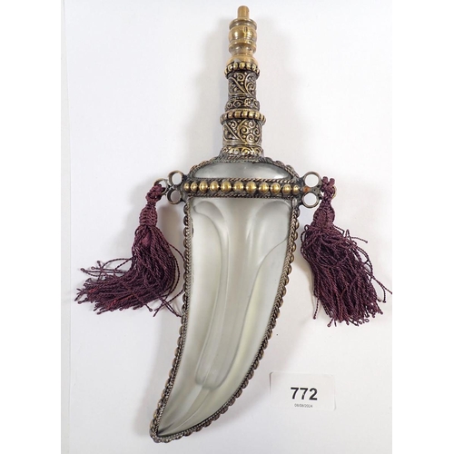 772 - A Middle Eastern glass scent bottle in the form of a dagger with gilt metal mounts, 7.5cm tall