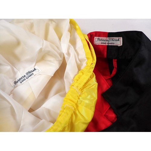 797 - Jockey silks in red and black by Turners, Thirsk plus a yellow cap