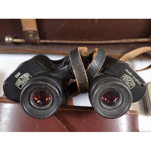 802 - A pair of binoculars, leather music case, large cigar, book form money box etc.