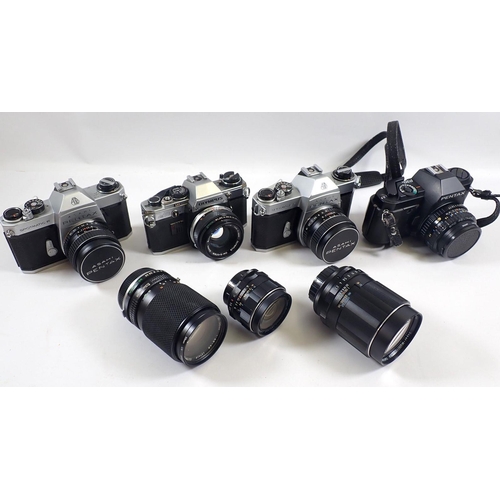 824 - A group of cameras including two Asahi Pentax Spotmatic F, a P30 and an Olympus OM10 with various le... 