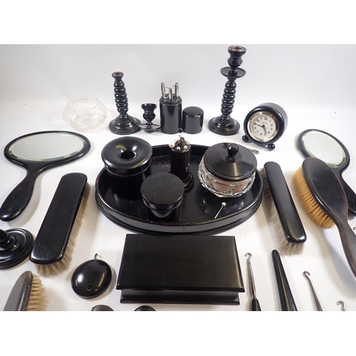 847 - An ebony dressing table set etc.