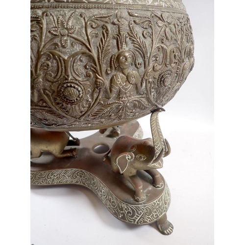 872 - A late 19th century Indian brass bowl on triform stand with three elephant supports, 30cm tall