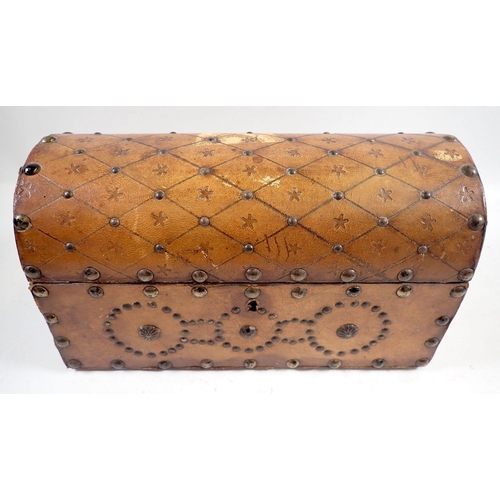 875 - A leather studded wooden dome top box, 26cm wide