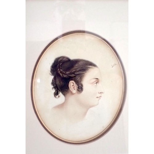 900 - A 19th century oval pencil and wash portrait of a Victorian girl, 16.5 x 13.5cm