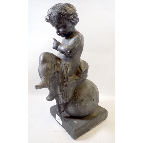 903 - An antique lead garden figure of a cherub seated on sphere, on plinth base, 39cm high