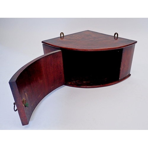 905 - A small mahogany bow fronted corner cupboard, 45cm wide x 20cm tall