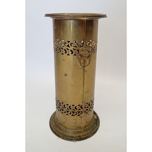 914 - A brass stick stand with lion mask handles