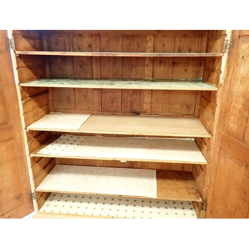 921 - A Victorian large pine kitchen or scullery cupboard with two doors enclosing shelves, 144 x 170 x 50... 