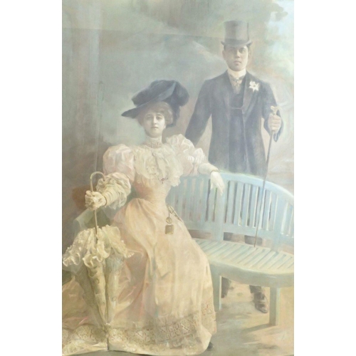 924 - A 19th century large pastel portrait of man and woman seated and standing by a blue bench, 100 x 72c... 