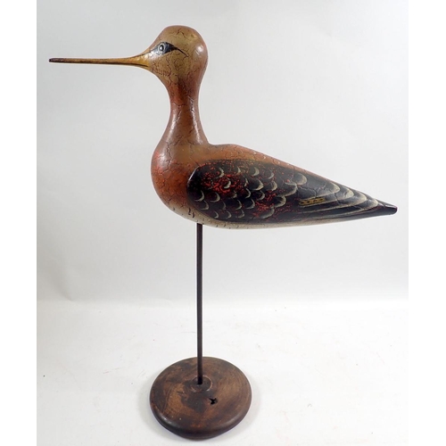 932 - An antique Folk Art carved and painted wooden snipe on stand, 41cm