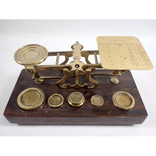 947 - A brass postal scale and weights and five various other weights