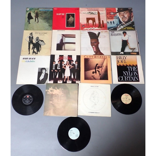 955 - A collection of 50 vinyl LP records of mainly rock and pop including Abba, U2, Elvis Costello, The B... 