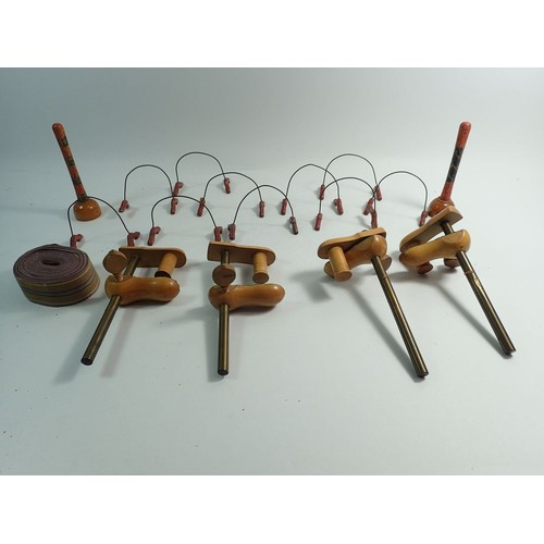 1019 - A Victorian table croquet set on turned mahogany  stand with mallets, balls, clamps and hoops