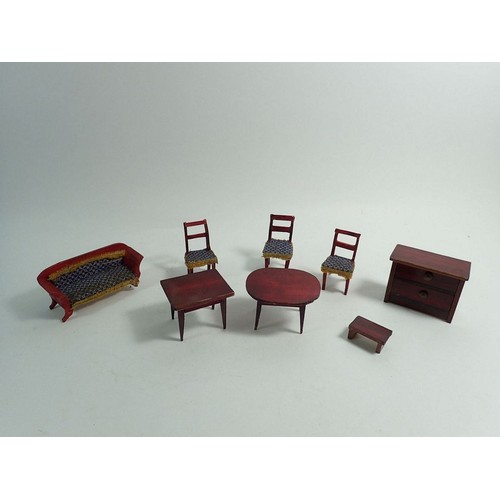 516 - A group of Victorian and later dolls house furniture including cast iron bed, garden tools etc.