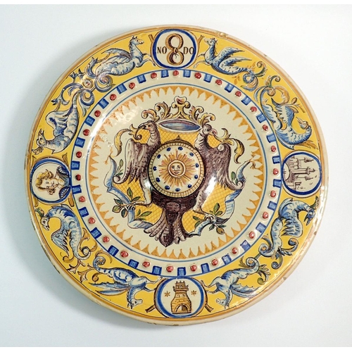 1 - An Italian large maiolica dish with eagle crest to centre and mythological beast border, 42cm