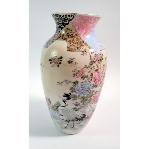 104 - A Japanese porcelain vase painted storks and flowers in enamels, 25cm