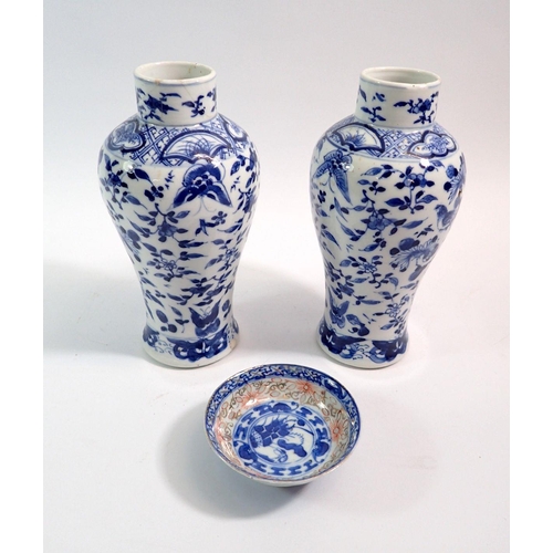 105 - A pair of Chinese blue and white baluster vases decorated birds, butterflies and flowers, four chara... 