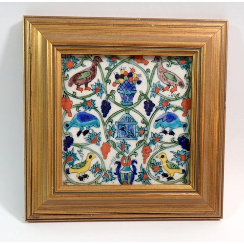 11 - An Isnik tile painted birds in gilt frame, 13.5cm square