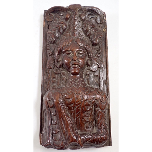 1103 - A 17th century oak carved narrow panel of a man under scroll and foliage surmount, 22 x 11cm