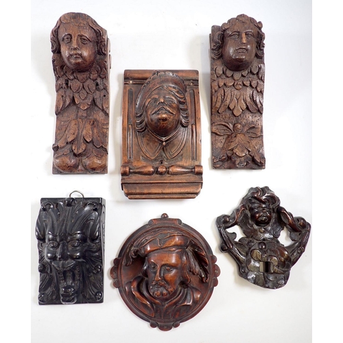 1105 - Six various carved wood small antique wall brackets with cherub, mask and ebony roaring head decorat... 