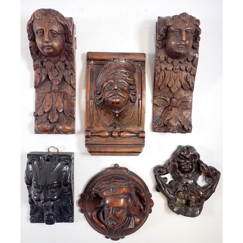 1105 - Six various carved wood small antique wall brackets with cherub, mask and ebony roaring head decorat... 