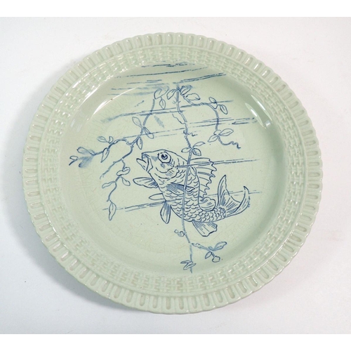 111 - A Pinder Bourne & Co plate printed fish within basket weave border, 22.5cm diameter