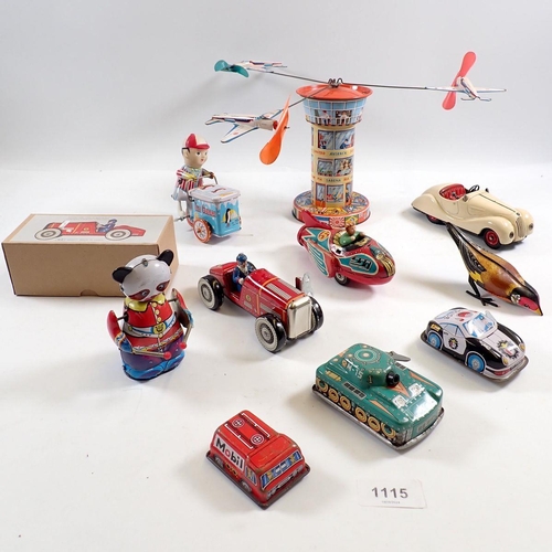 1115 - A Schuco Examico 4001 wind up car plus a group of various tin plate and wind up toys