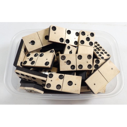 1131 - An antique bone and ebony set of dominoes