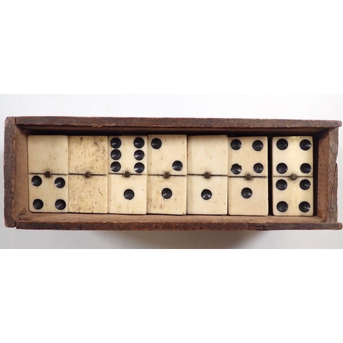 1132 - A set of antique bone and ebony dominoes in wooden box (28)