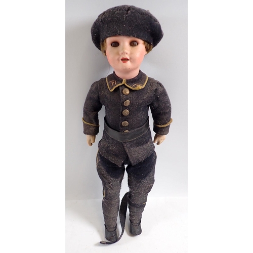 1136 - A WWI SBFJ bisque headed soldier doll in military dress, 39cm tall