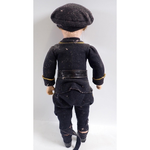 1136 - A WWI SBFJ bisque headed soldier doll in military dress, 39cm tall