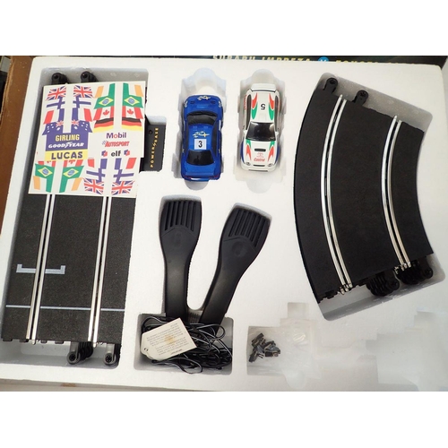 1143 - A Scalextric Rally Racing set, a Scalextric Formula One set plus another Formula 500 slot racing set... 