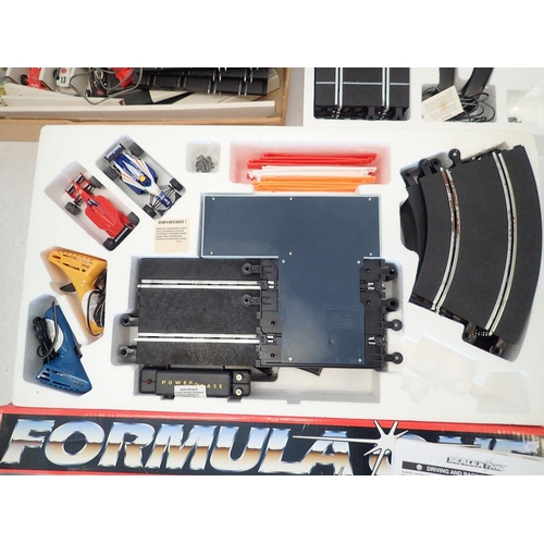 1143 - A Scalextric Rally Racing set, a Scalextric Formula One set plus another Formula 500 slot racing set... 