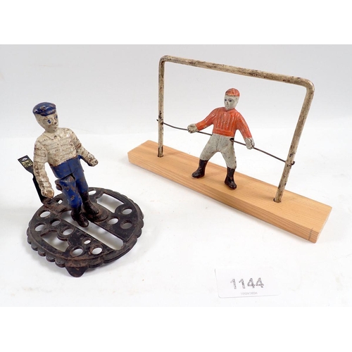 1144 - A Victorian miniature cast iron toy footballer figure with moving leg, 10.5cm tall plus goal keeper ... 