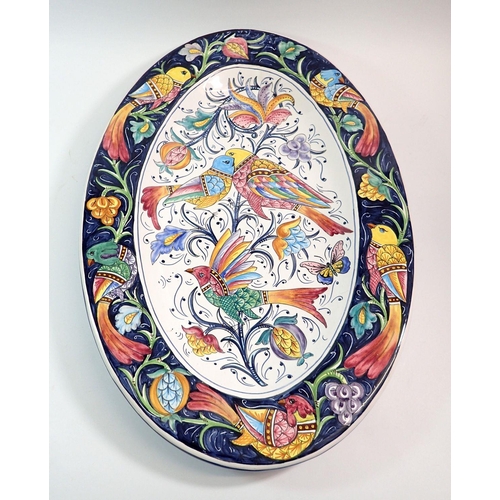 116 - A vintage large Italian maiolica oval dish painted birds, 61cm