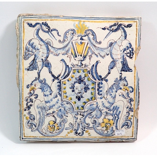 12 - A large Italian maiolica tile with stork and grotesque decoration, 20 x 20cm