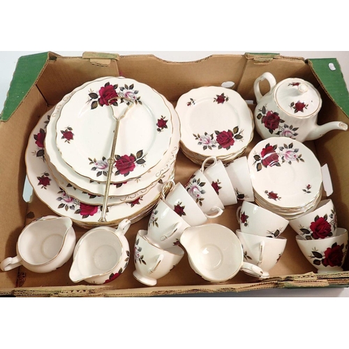 120 - A Coclough vintage tea and dinner service comprising eight dinner plates, ten cups and saucers, cake... 