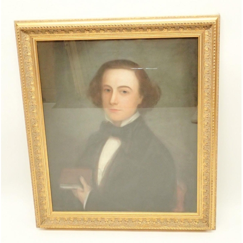 1206 - A 19th century pastel portrait of young gentleman holding a book, 75 x 61cm in gilt frame