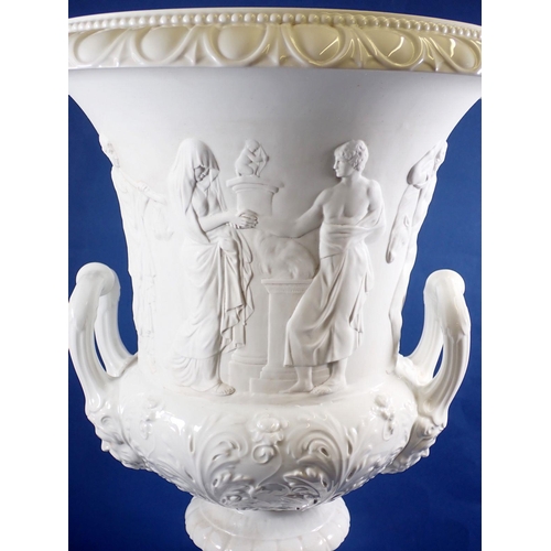 121 - A Ginori porcelain large campana style urn with classical figures in relief on plinth base, 63cm tal... 