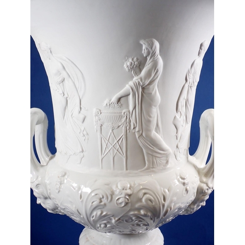 121 - A Ginori porcelain large campana style urn with classical figures in relief on plinth base, 63cm tal... 