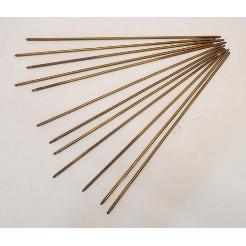 1239 - A set of thirteen brass stair rods 76cm long