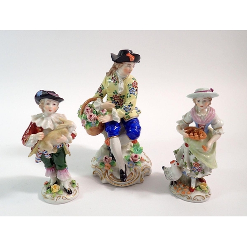 125 - A pair of small Sitzendorf figures and a flower seller figure, 12cm