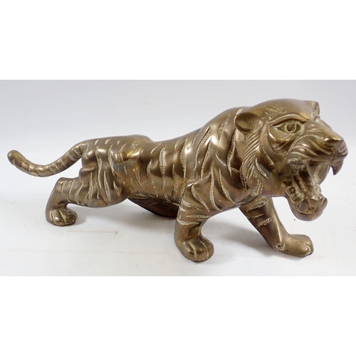 1258 - A large cast brass Bengal tiger figure, 39cm long