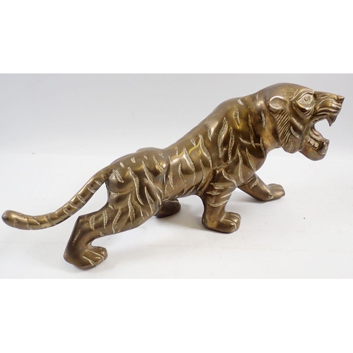 1258 - A large cast brass Bengal tiger figure, 39cm long