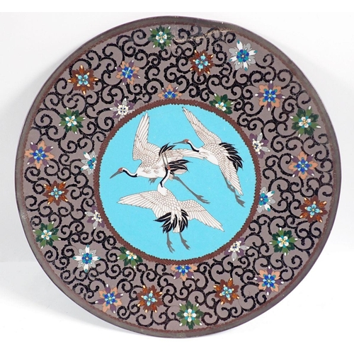 1260 - A pair of Japanese Meiji period cloisonne plates decorated storks, 30cm diameter