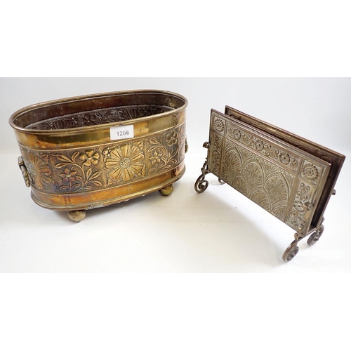 1266 - A brass embossed oval jardiniere, 31cm wide and a brass letter rack with Gothic arch and floral deco... 