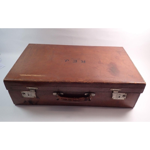 1287 - An antique leather suitcase by Finnigans of London, 61cm wide