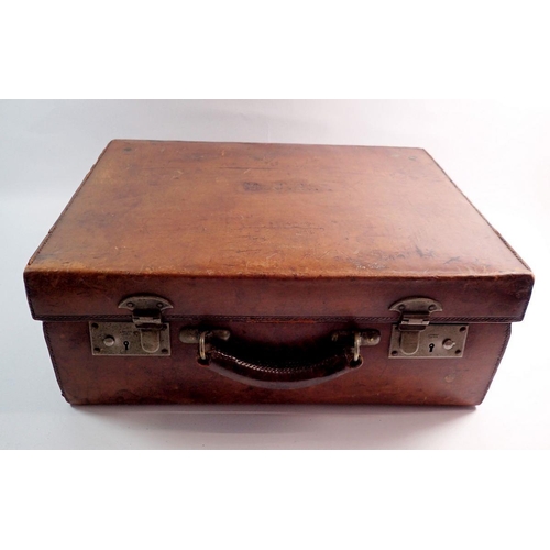 1288 - An antique leather suitcase