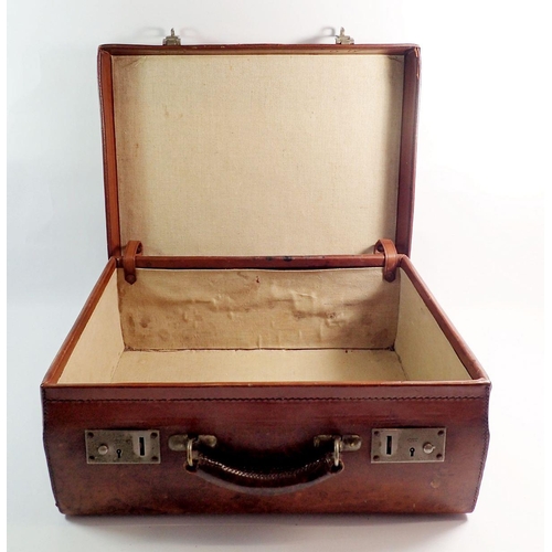 1288 - An antique leather suitcase