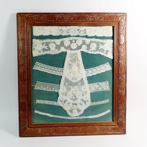 1296 - A framed collection of antique lace samples, 35 x 29cm